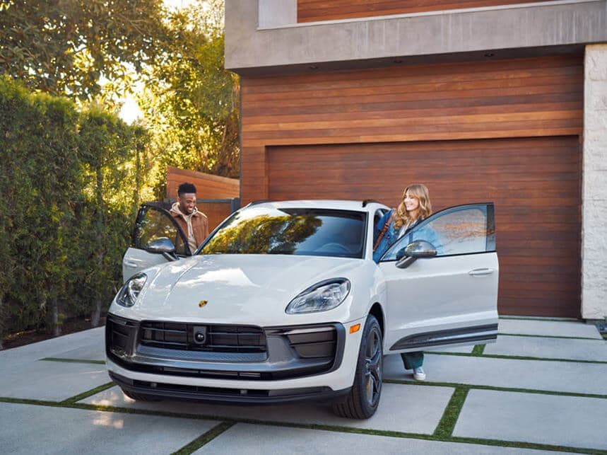 Taking delivery of their new Porsche at home